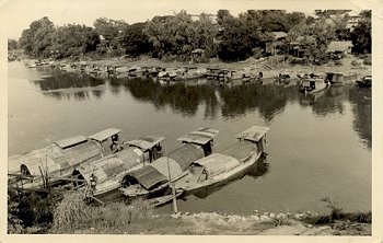 River Scene with numerous small boats moored